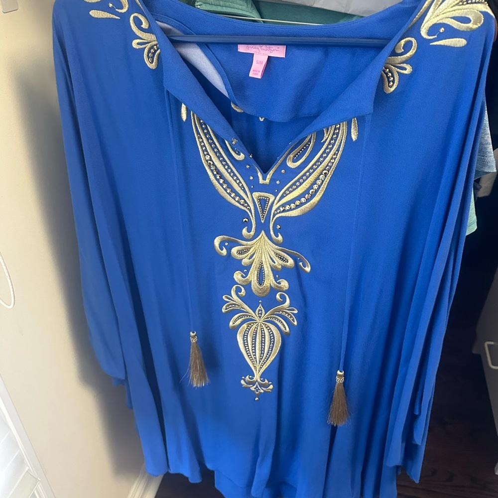 this royal blue and gold Caftan dress with tassels is so much fun to wear.